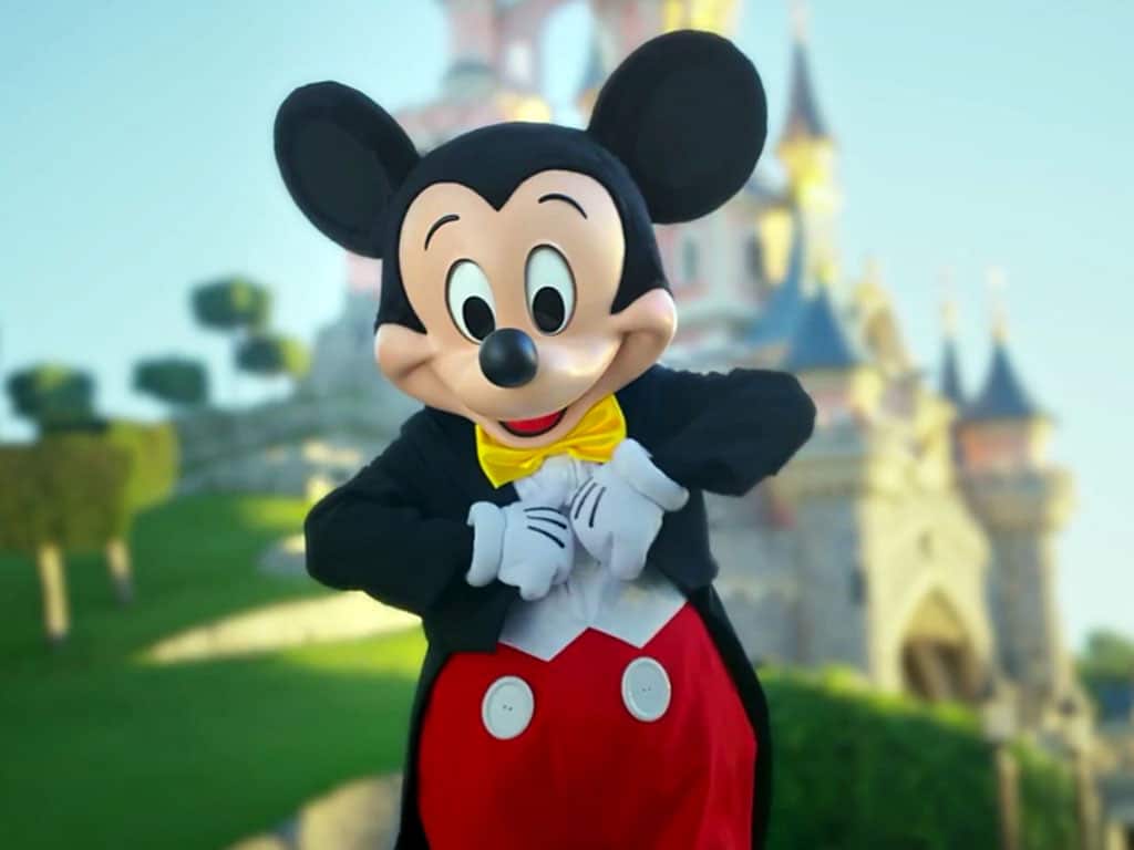 Mickey Mouse at the castle in Disneyland Paris, book your tickets at GetYourTicket