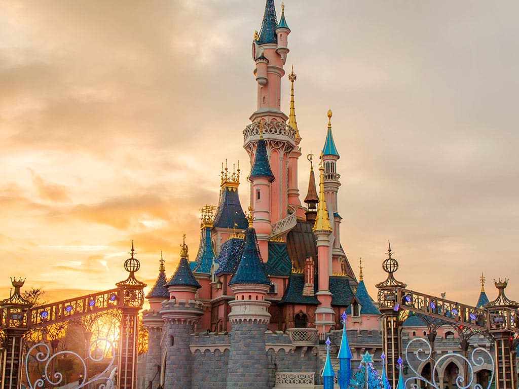 The Disneyland Paris castle at sunset, book your tickets at GetYourTicket - Paris Whatsup